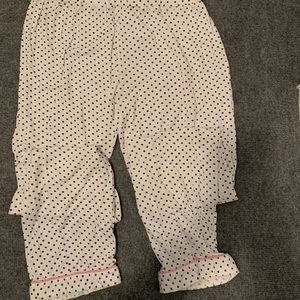 White and black polka dot pants.